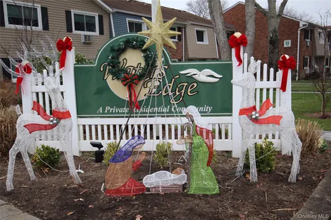 a view of a house with a yard and a deck