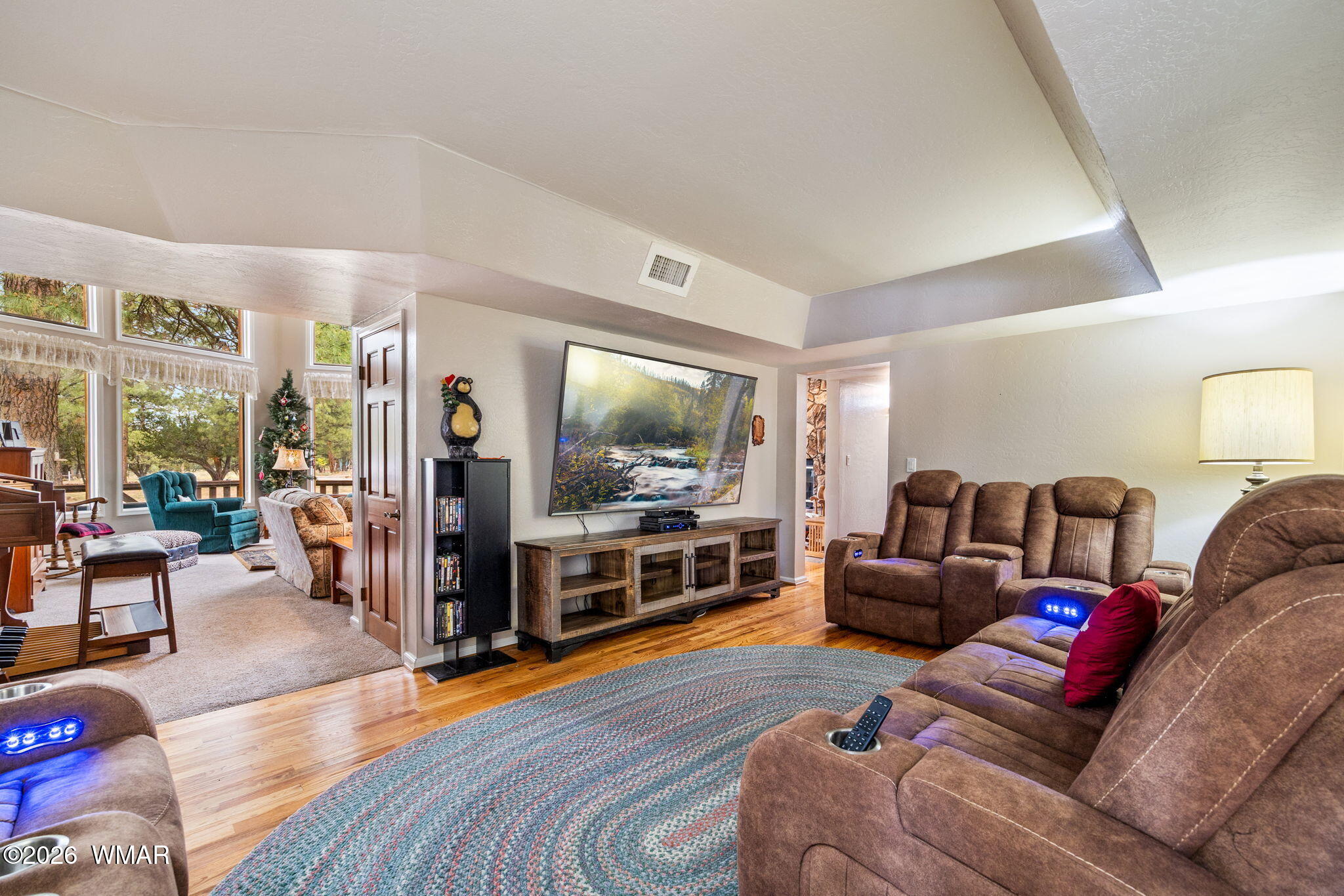 2922 Pine Rim Road Overgaard, AZ 85933 - Photo 12 of 58 a living room with furniture and a flat screen tv