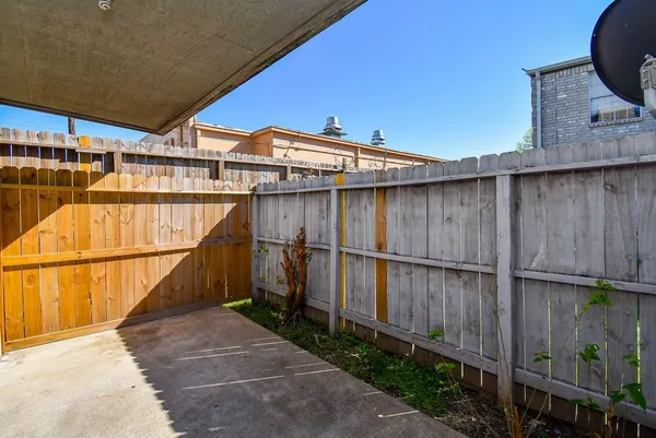 a view of a balcony with wooden floor