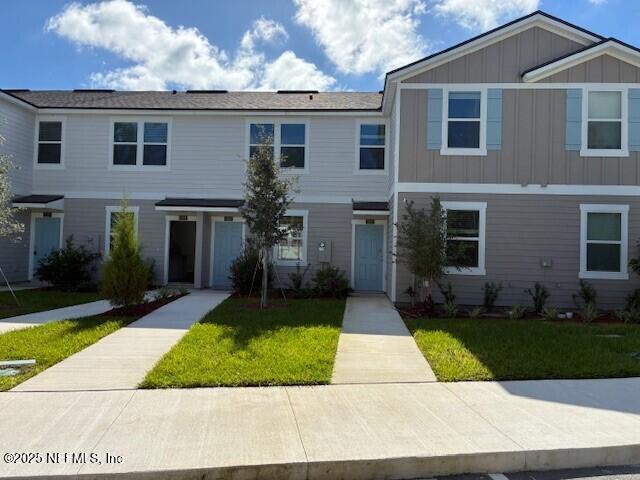 218 Palmetto Rdg Road St. Augustine, FL 32095 - Photo 1 of 37 a front view of a house with a yard