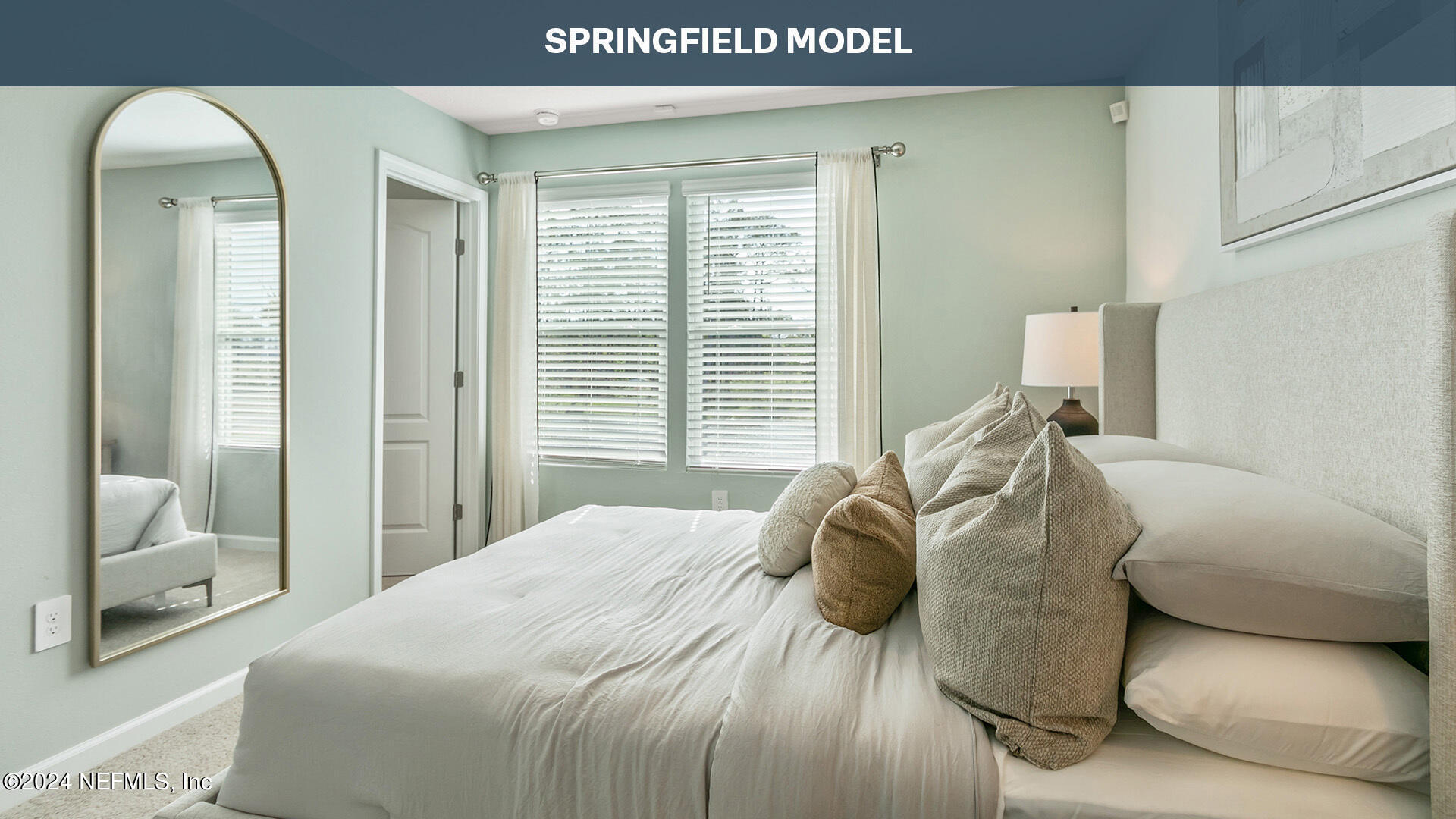 218 Palmetto Rdg Road St. Augustine, FL 32095 - Photo 13 of 37 a bedroom with a bed and a mirror