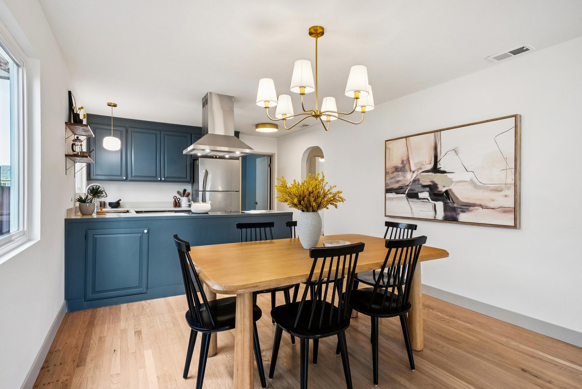 400 Harbor Light Road Alameda, CA 94501 - Photo 16 of 58 a dining room filled chandelier and wooden floor