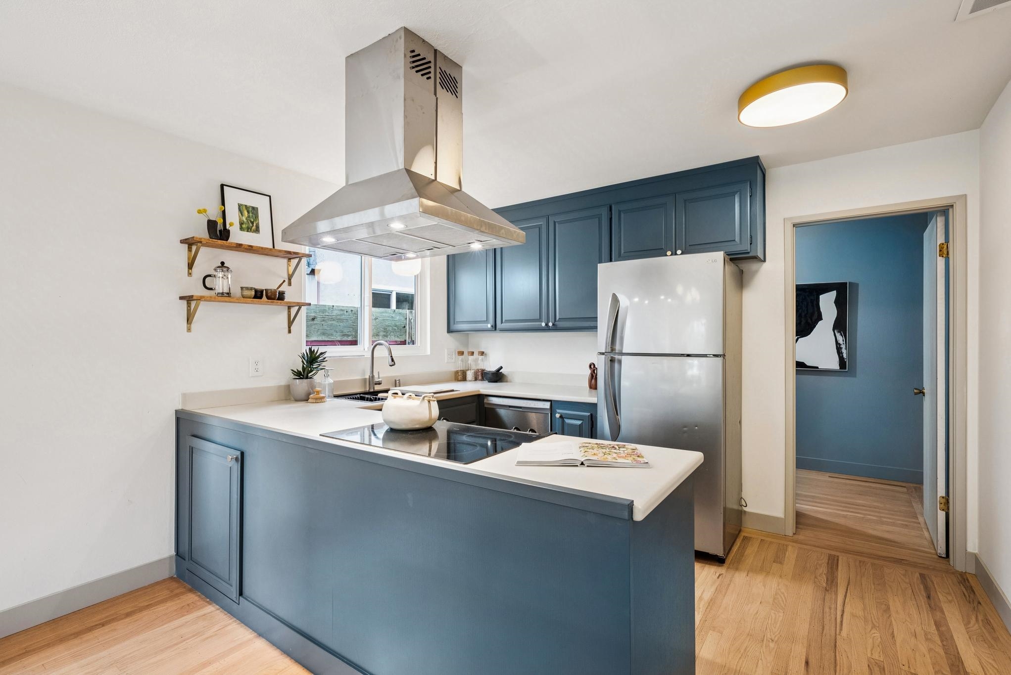 400 Harbor Light Road Alameda, CA 94501 - Photo 17 of 58 a kitchen with a sink a refrigerator and a stove