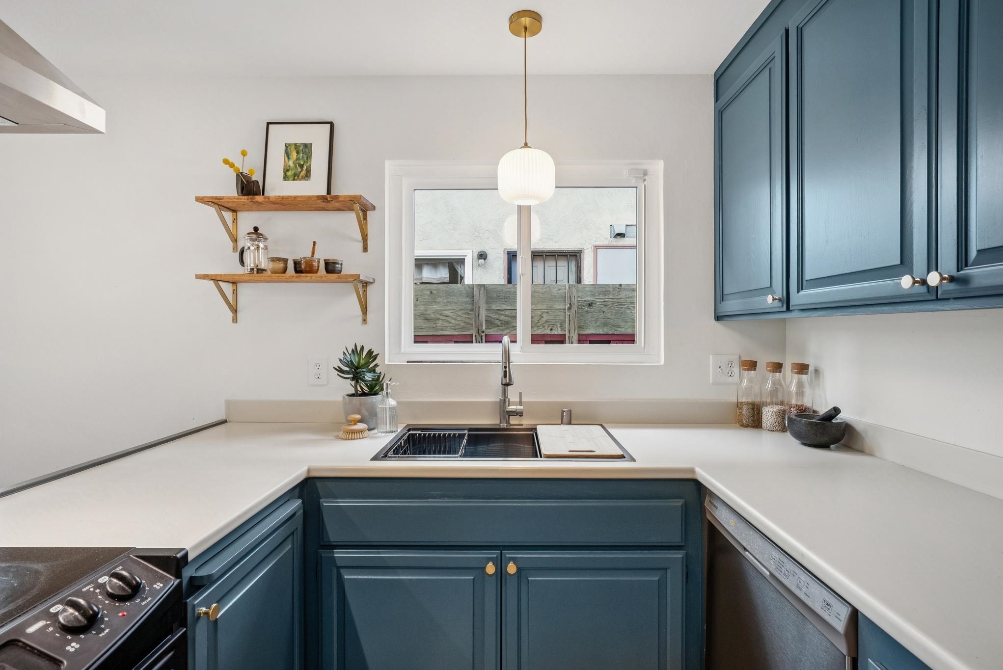400 Harbor Light Road Alameda, CA 94501 - Photo 18 of 58 a kitchen with a sink and cabinets