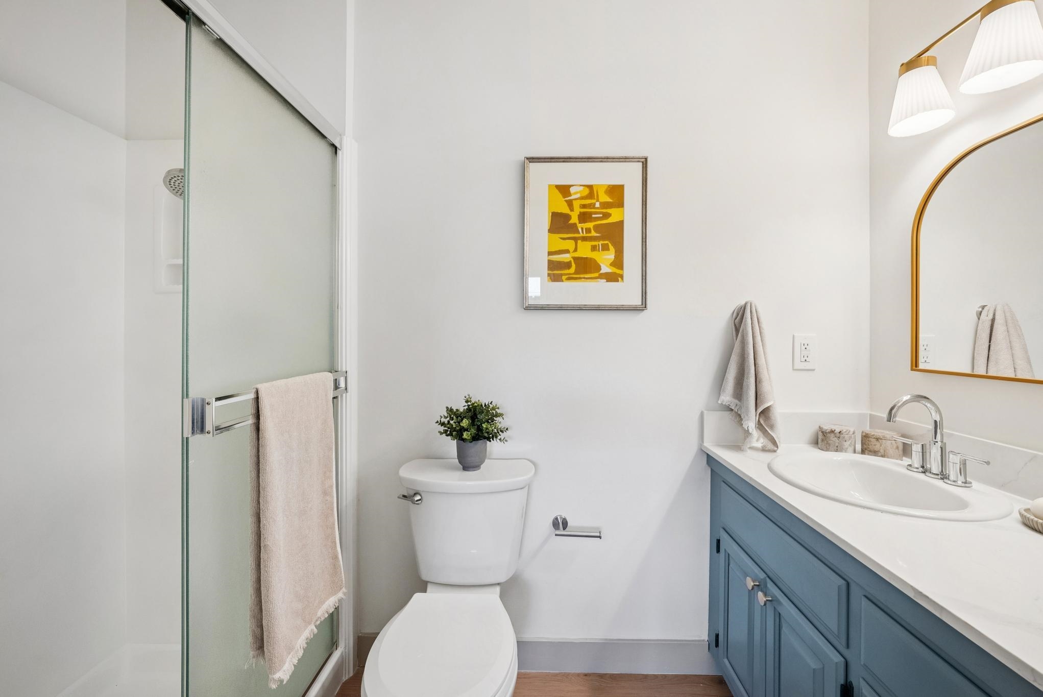 400 Harbor Light Road Alameda, CA 94501 - Photo 24 of 58 a bathroom with a toilet sink and mirror