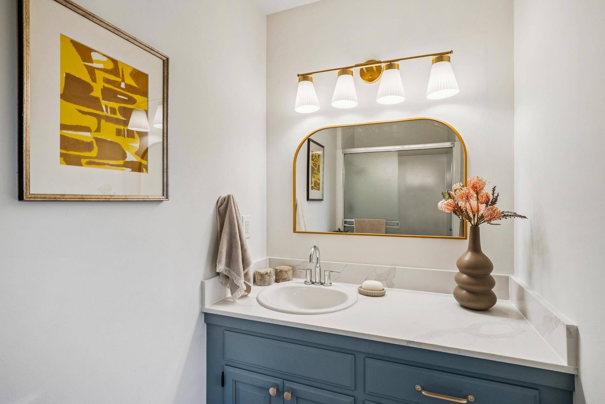 400 Harbor Light Road Alameda, CA 94501 - Photo 25 of 58 a bathroom with a sink and a mirror