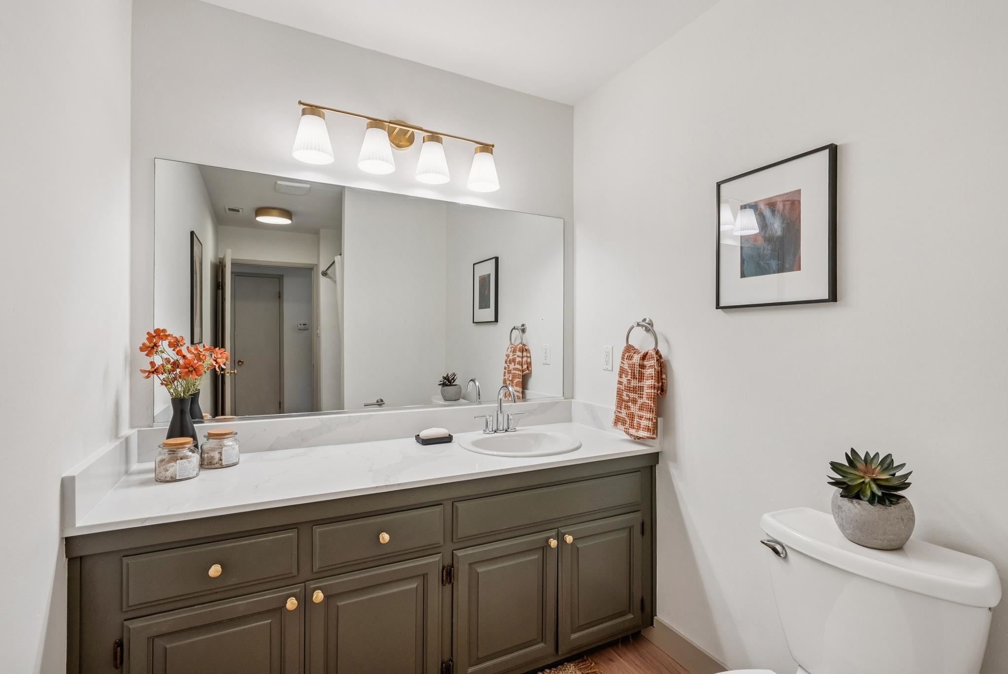 400 Harbor Light Road Alameda, CA 94501 - Photo 31 of 58 a bathroom with a toilet a sink and mirror