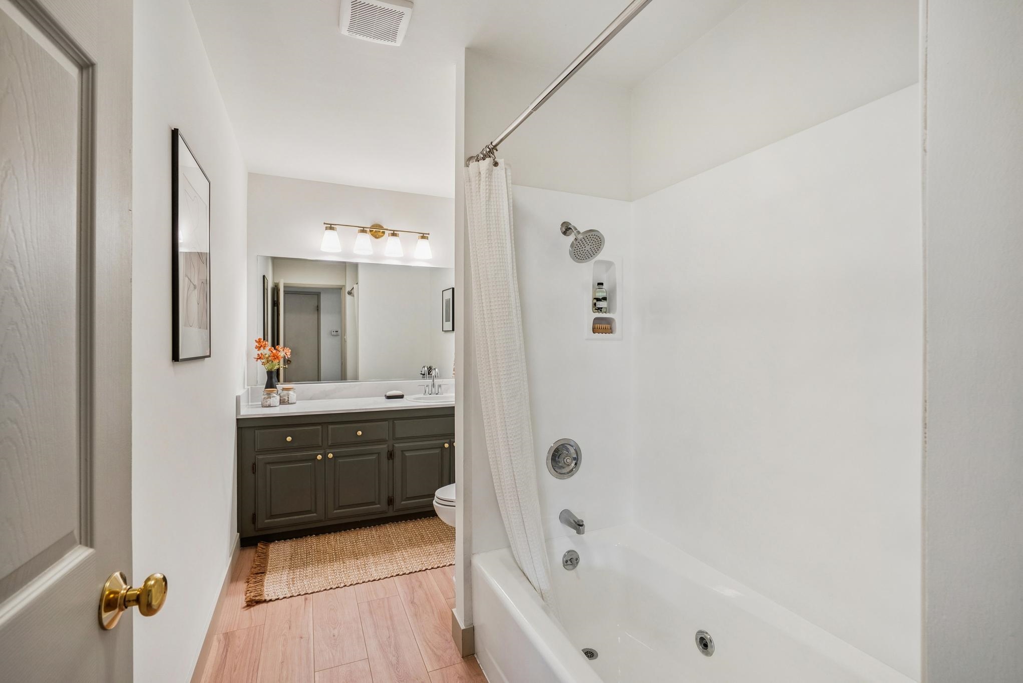 400 Harbor Light Road Alameda, CA 94501 - Photo 32 of 58 a bathroom with a tub sink shower and mirror
