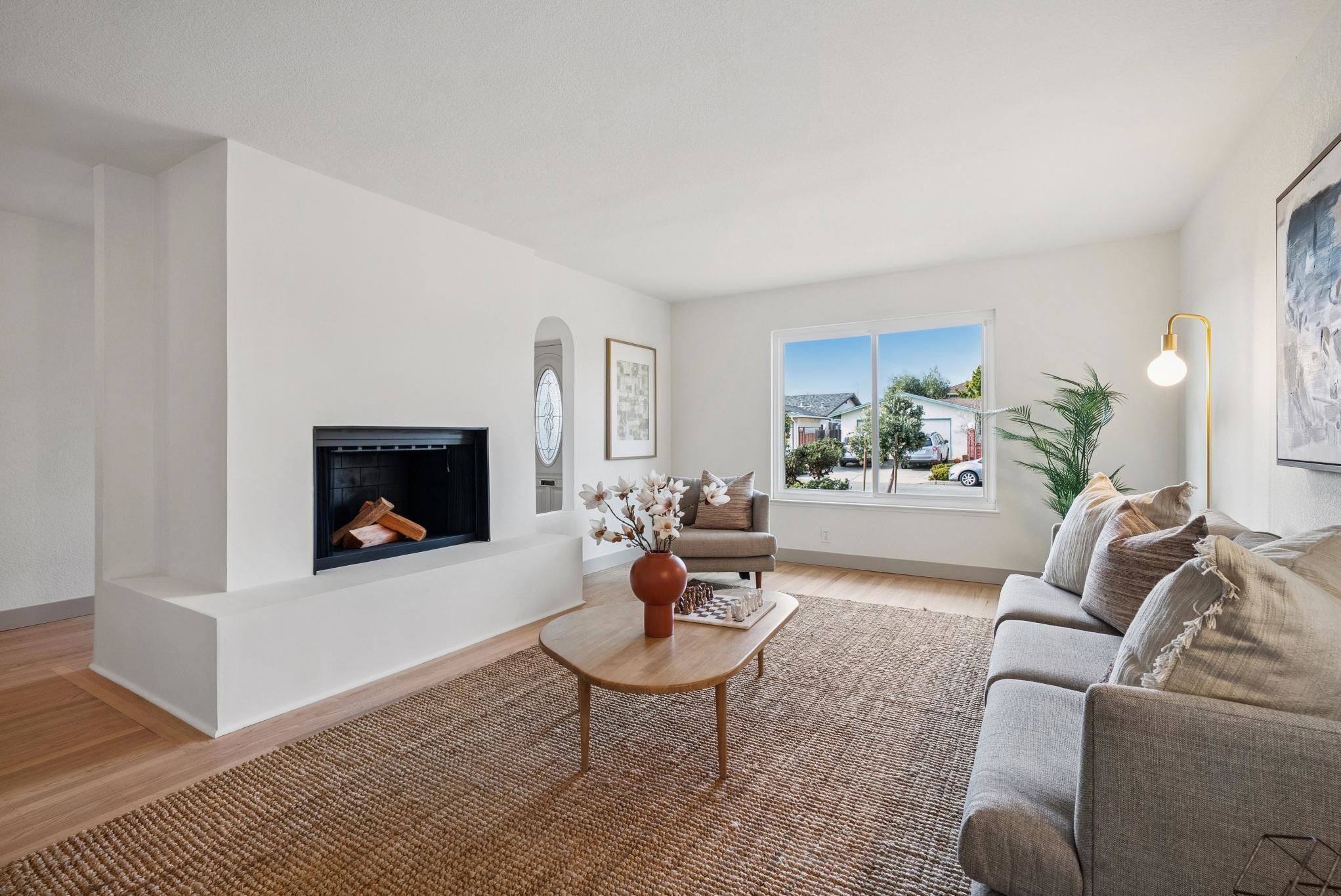 400 Harbor Light Road Alameda, CA 94501 - Photo 4 of 58 a living room with furniture and a fireplace