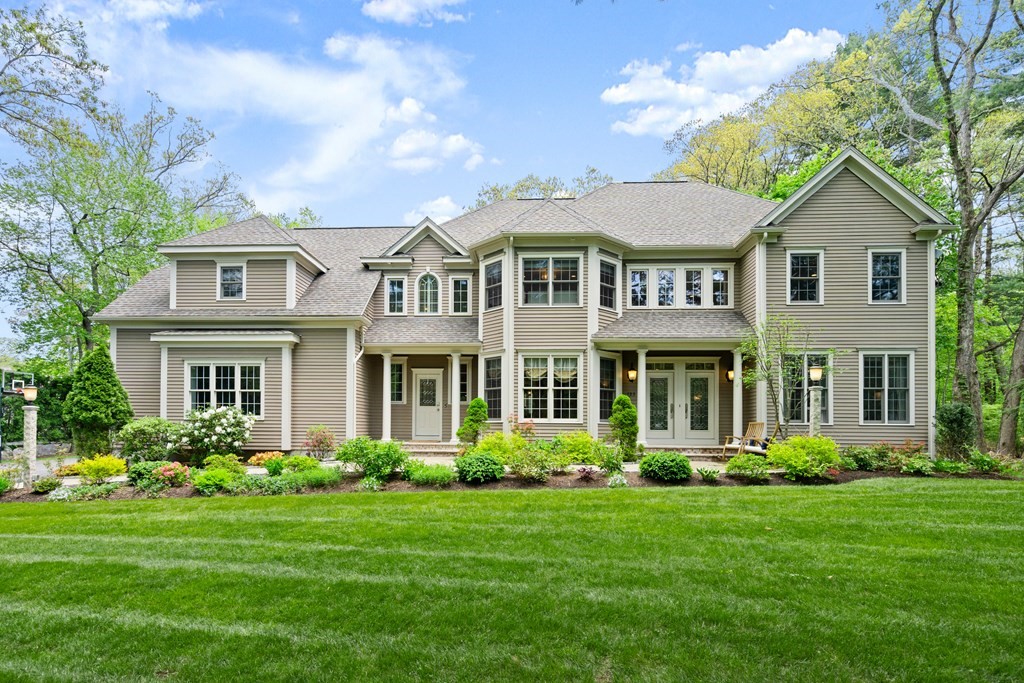 123 Country Way Needham, MA 02492 - Photo 1 of 35 a front view of a house with a yard
