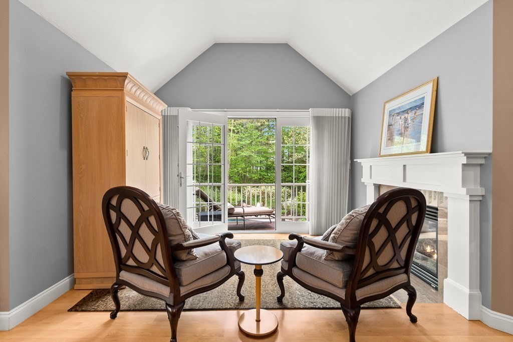 123 Country Way Needham, MA 02492 - Photo 14 of 35 a living room with furniture and a fireplace