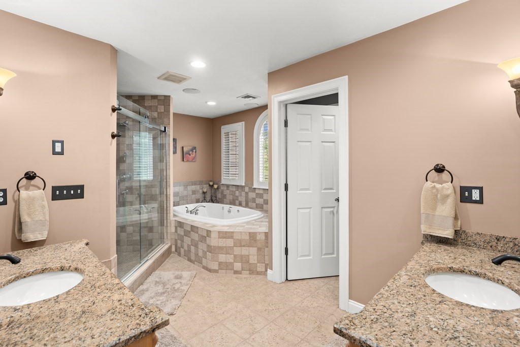 123 Country Way Needham, MA 02492 - Photo 17 of 35 a bathroom with a granite countertop sink a toilet and shower