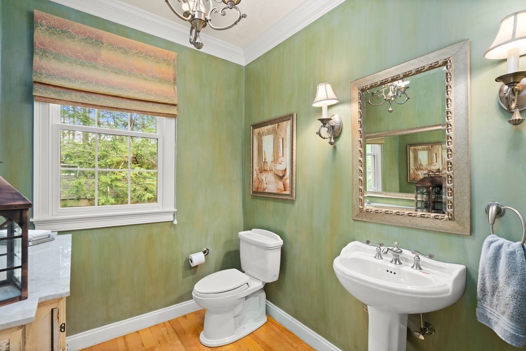 123 Country Way Needham, MA 02492 - Photo 21 of 35 a bathroom with a sink and a mirror