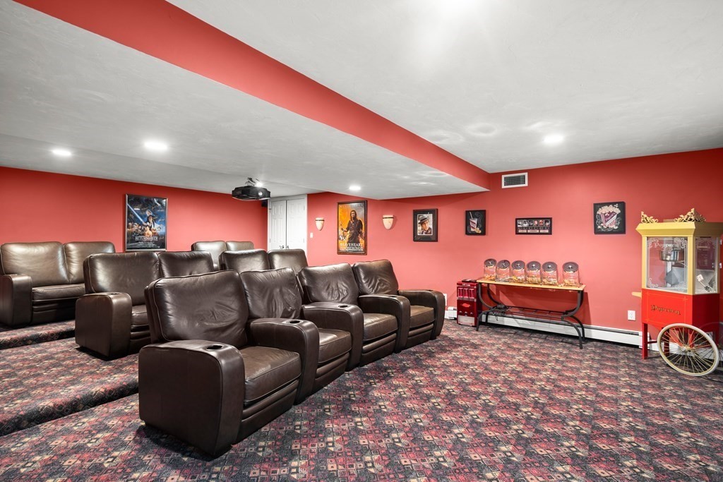 123 Country Way Needham, MA 02492 - Photo 22 of 35 a living room with furniture and a projector