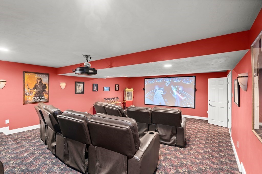123 Country Way Needham, MA 02492 - Photo 23 of 35 a living room with furniture a projector and screen