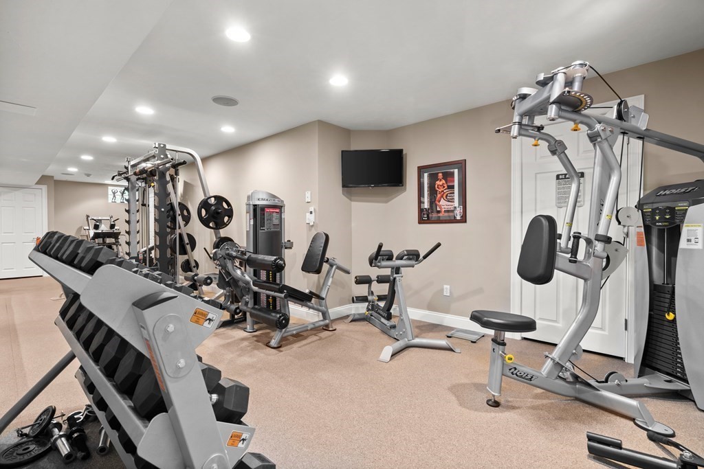 123 Country Way Needham, MA 02492 - Photo 24 of 35 a view of a room with gym equipment