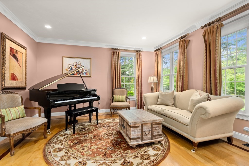 123 Country Way Needham, MA 02492 - Photo 4 of 35 a living room with furniture a large window and a flat screen tv