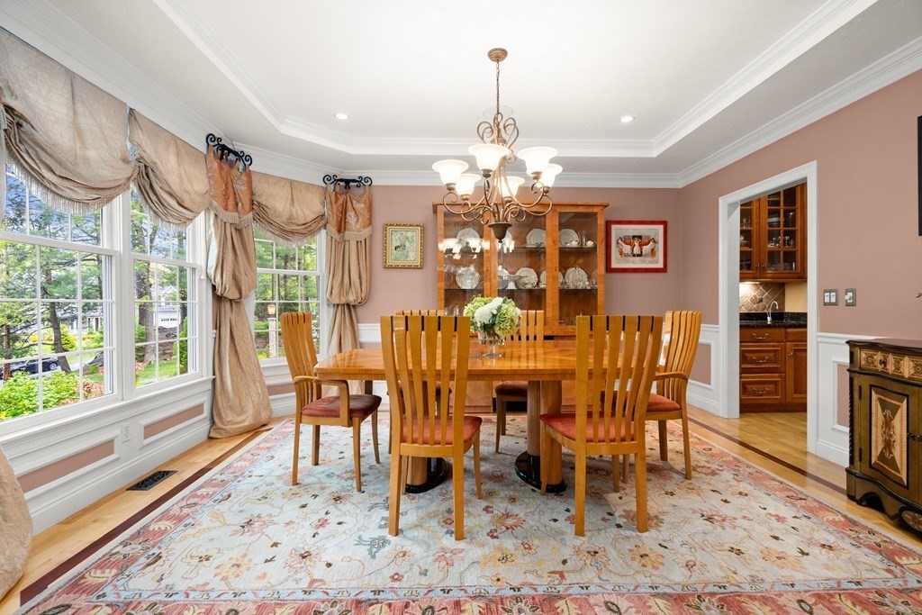 123 Country Way Needham, MA 02492 - Photo 5 of 35 a view of a dining room with furniture window and wooden floor
