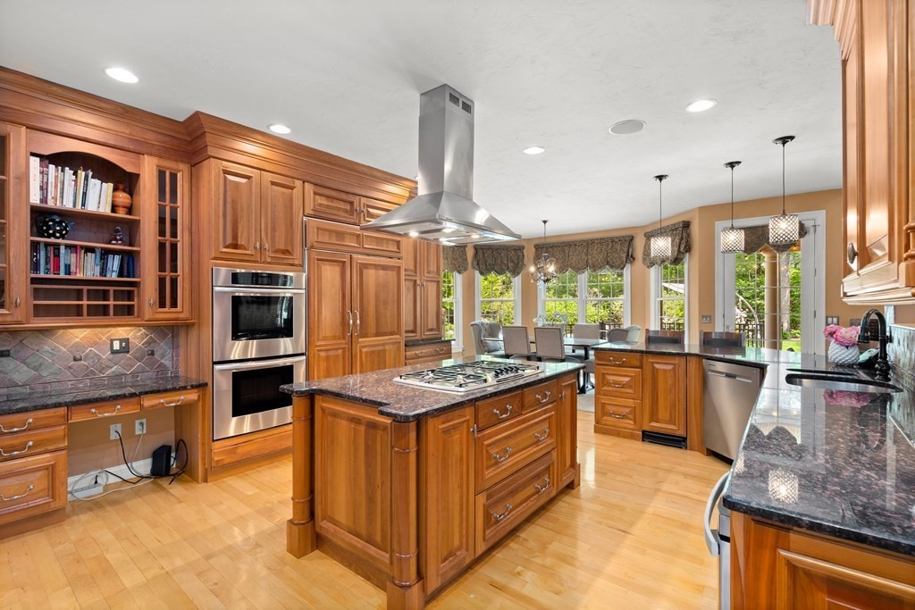 123 Country Way Needham, MA 02492 - Photo 7 of 35 a kitchen with stainless steel appliances granite countertop a stove and a refrigerator