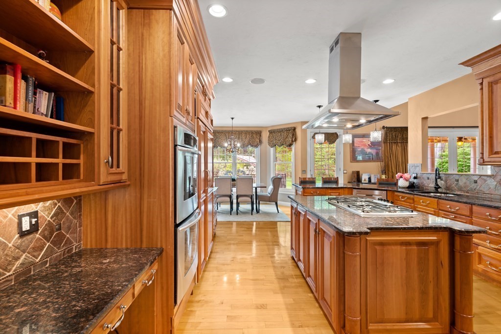 123 Country Way Needham, MA 02492 - Photo 8 of 35 a kitchen with stainless steel appliances granite countertop lots of counter top space and wooden floor
