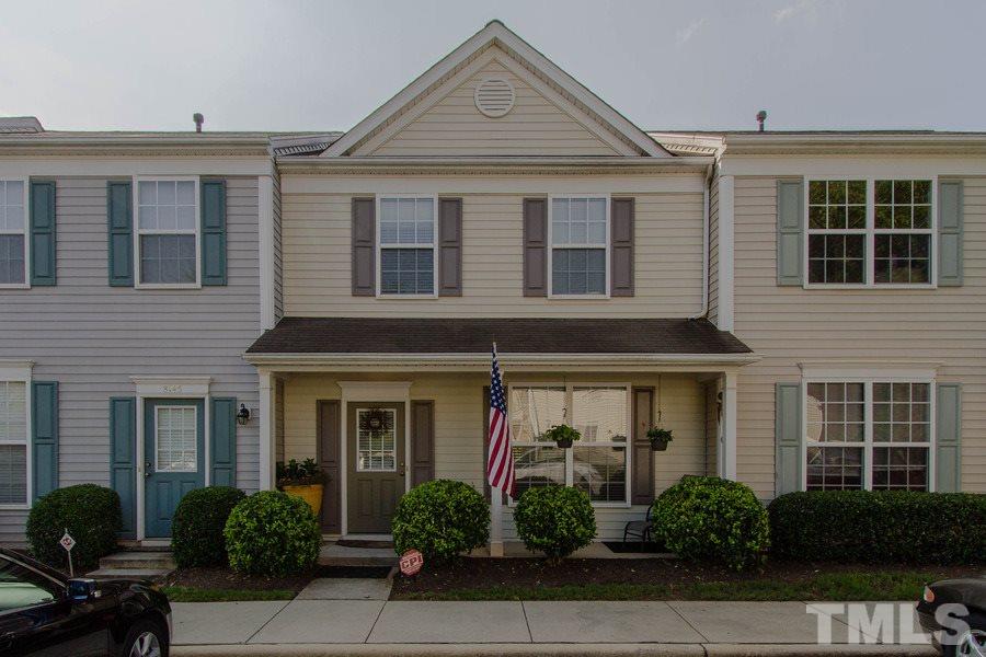 8147 Rhiannon Road Raleigh, NC 27613 - Photo 1 of 19 front view of a brick house with potted plants