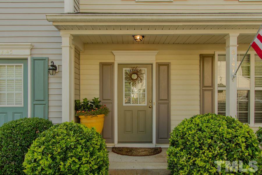 8147 Rhiannon Road Raleigh, NC 27613 - Photo 2 of 19 front view of a house with potted plants