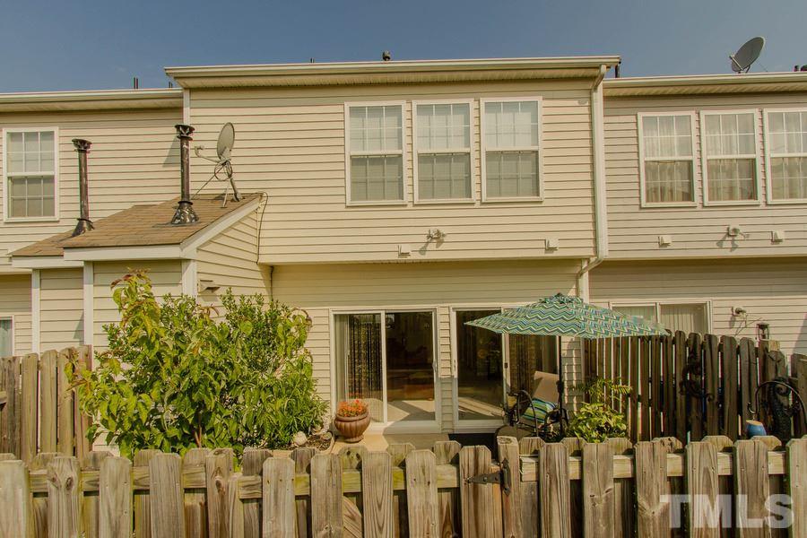 8147 Rhiannon Road Raleigh, NC 27613 - Photo 18 of 19 a front view of a house with a balcony