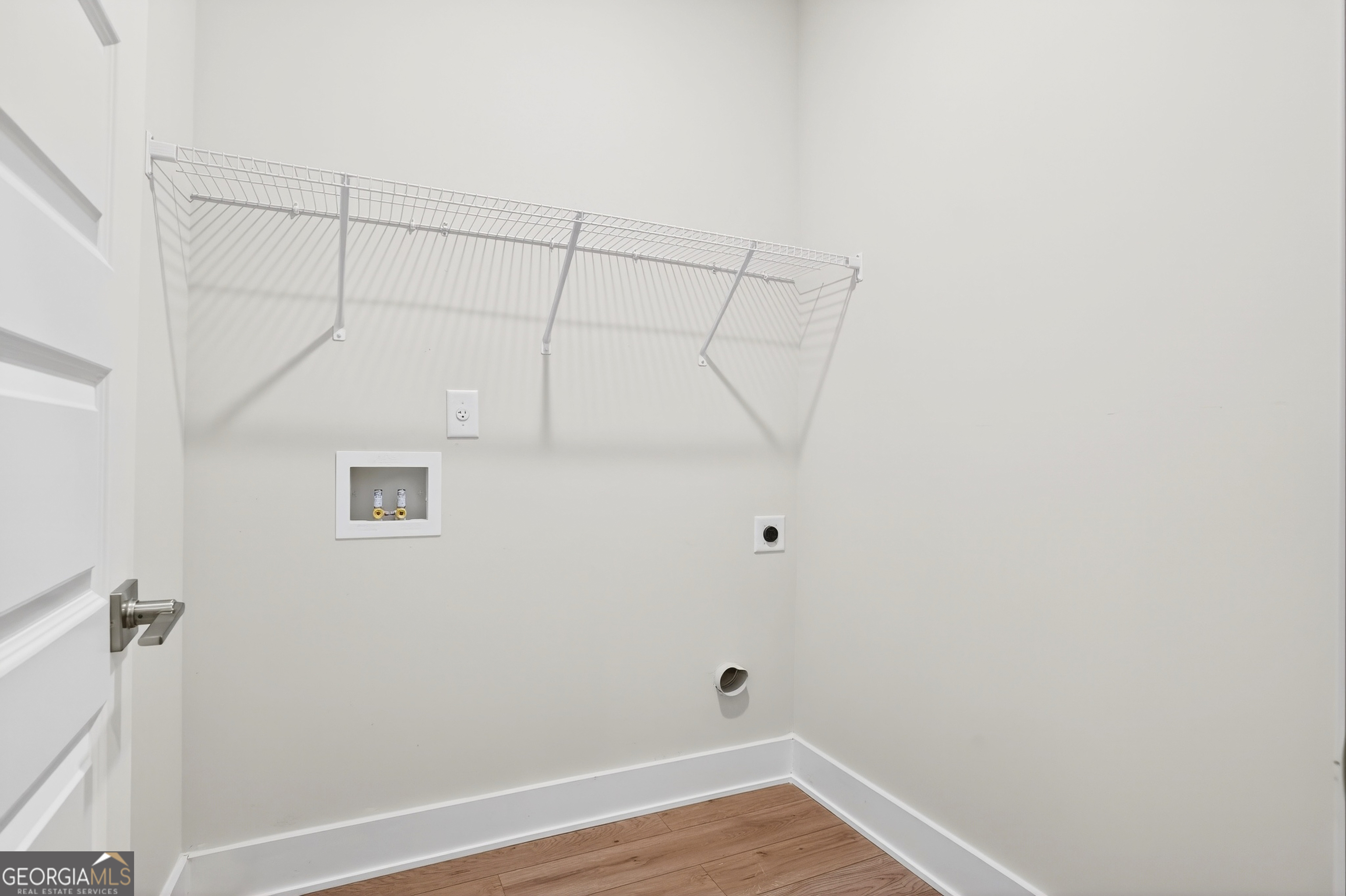 214 Villa Rica Springs Villa Rica, GA 30180 - Photo 16 of 33 Generously sized laundry room conveniently located adjacent to the primary suite.