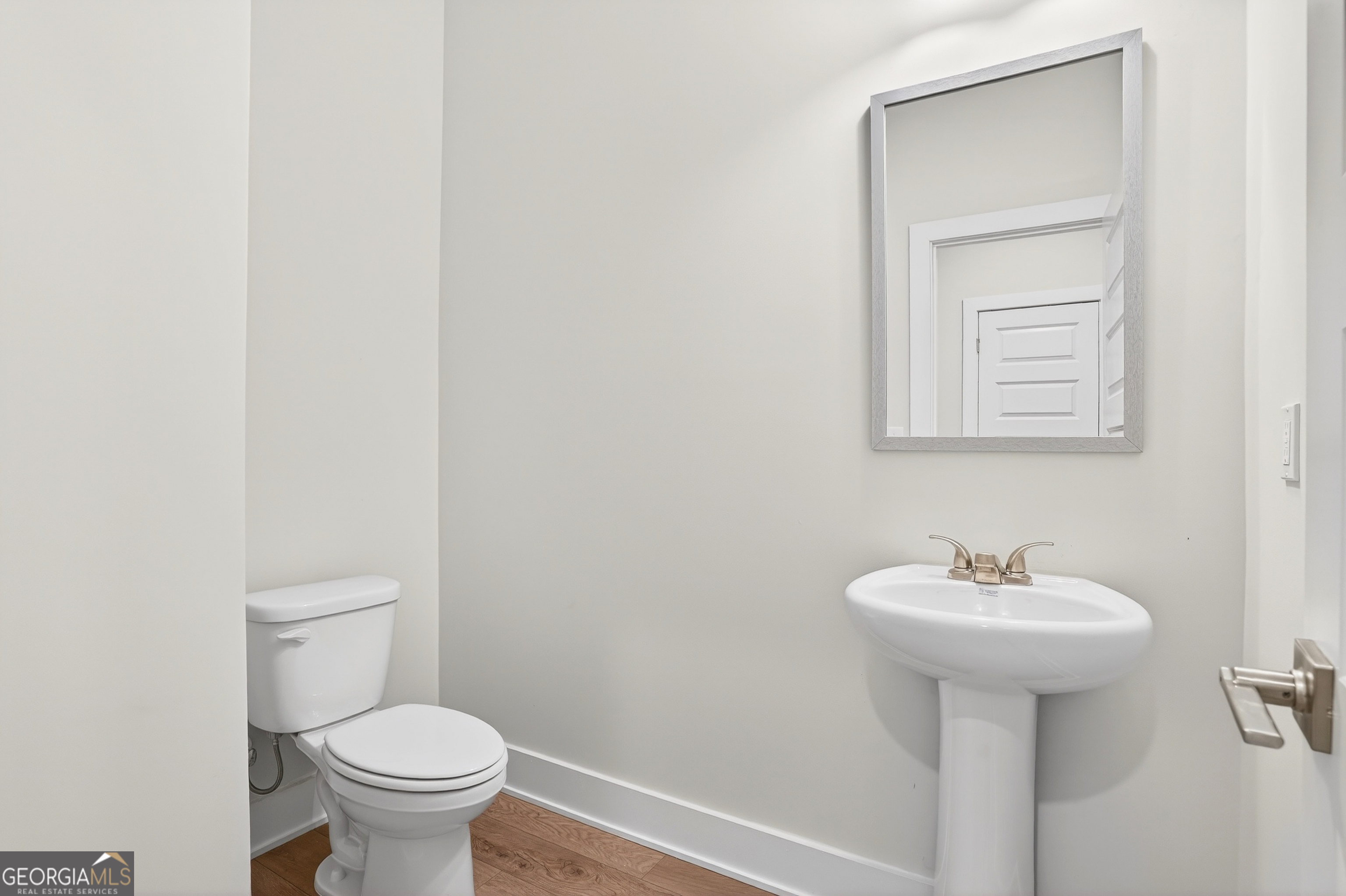 214 Villa Rica Springs Villa Rica, GA 30180 - Photo 17 of 33 Bright, well-appointed guest bath with pedestal sink and modern finishes.