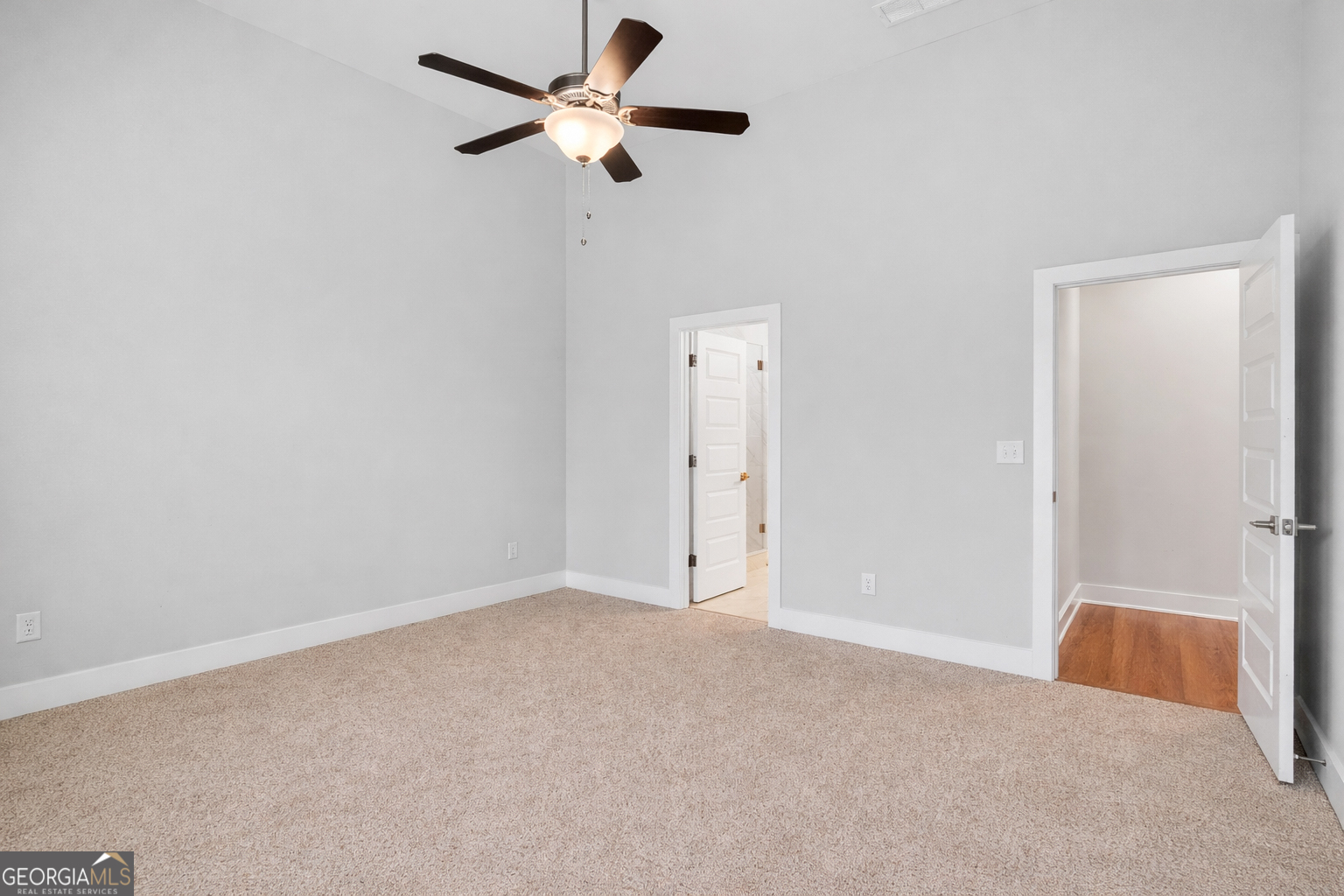 214 Villa Rica Springs Villa Rica, GA 30180 - Photo 18 of 33 Spacious primary bedroom on the main level with high ceilings