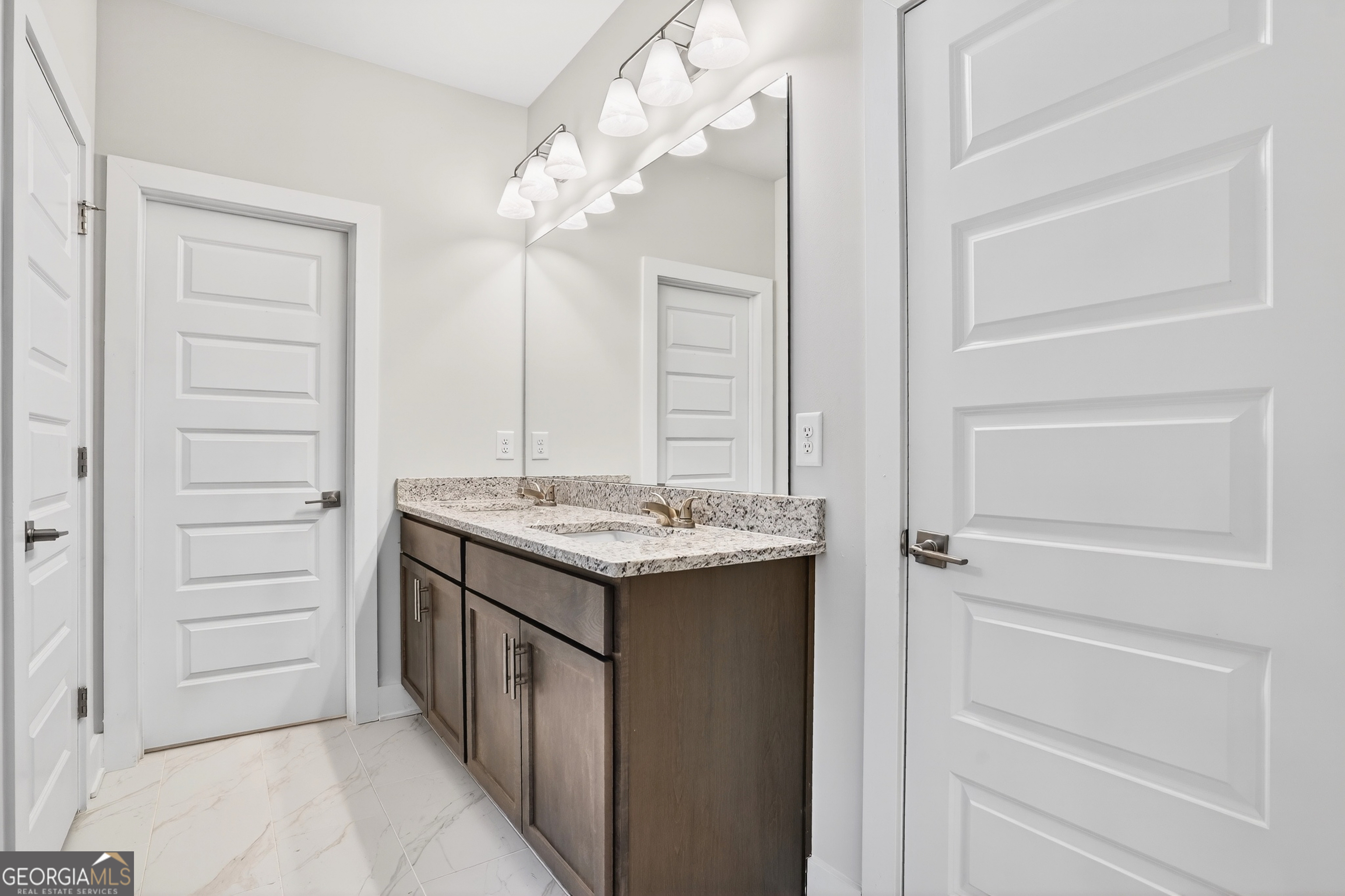 214 Villa Rica Springs Villa Rica, GA 30180 - Photo 21 of 33 Stylish primary ensuite featuring a dual-sink vanity, granite countertops, and modern lighting.