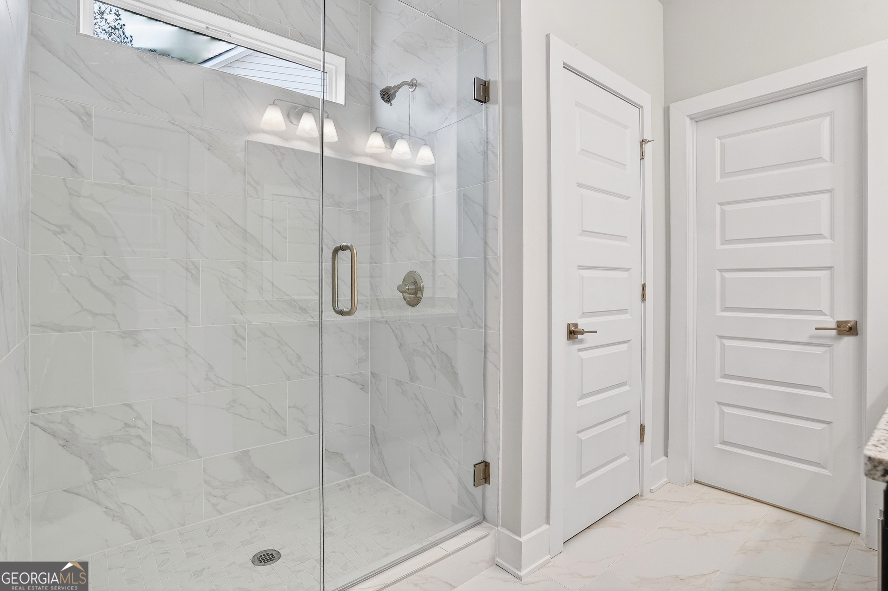 214 Villa Rica Springs Villa Rica, GA 30180 - Photo 22 of 33 Spa-inspired frameless glass shower with tiled walls and modern fixtures.