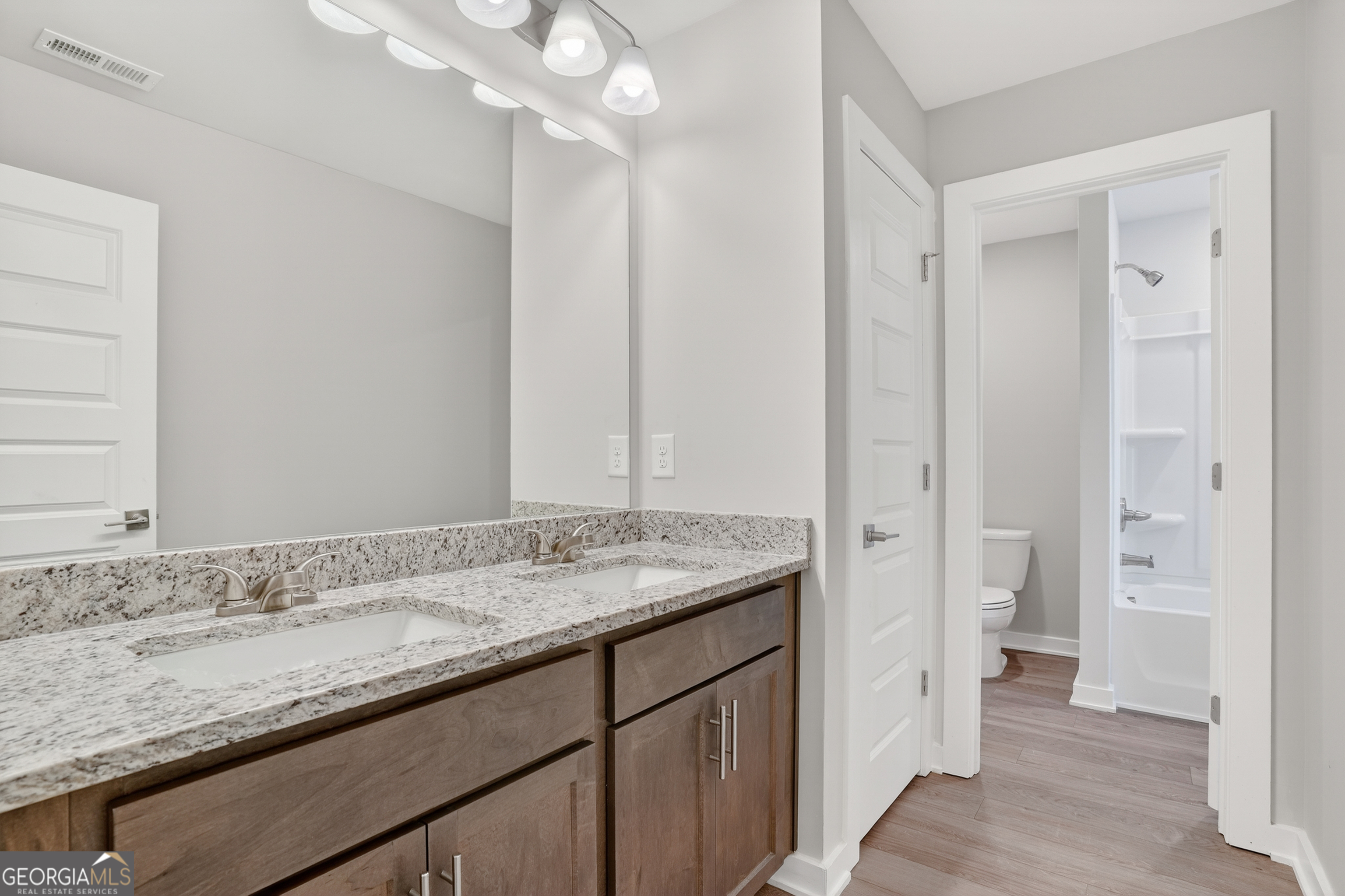 214 Villa Rica Springs Villa Rica, GA 30180 - Photo 29 of 33 Upstairs hall bath with dual-sink vanity, separate tub/shower and toilet area for added privacy