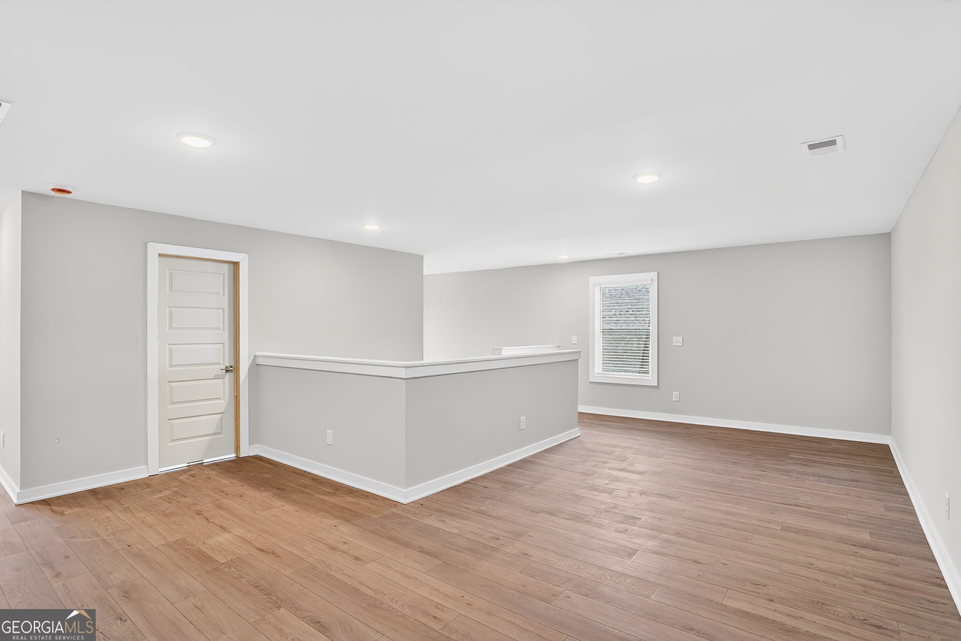 214 Villa Rica Springs Villa Rica, GA 30180 - Photo 31 of 33 Spacious upstairs loft with durable LVP flooring-ideal for a kids' playroom, homework space, or family movie nights.