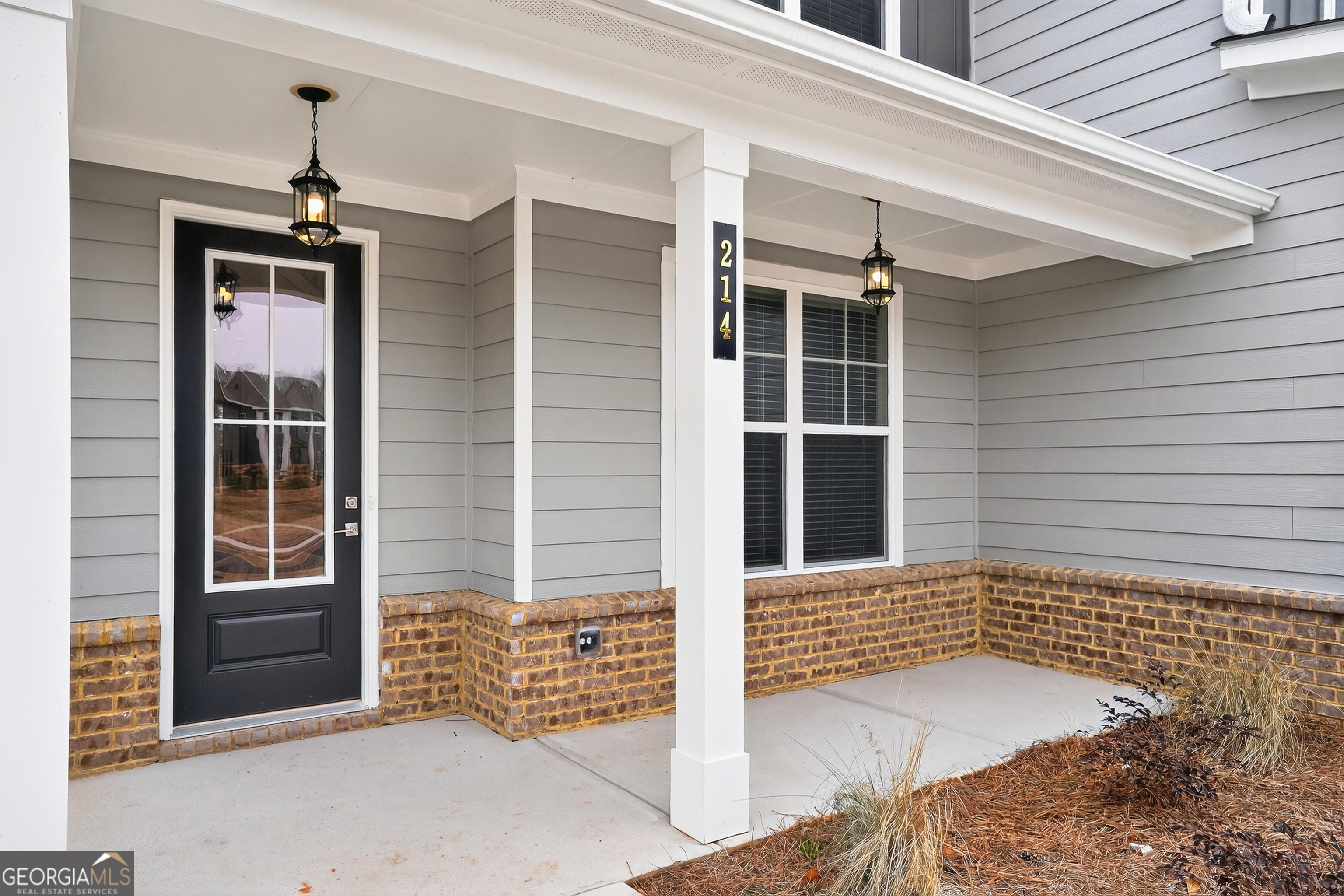 214 Villa Rica Springs Villa Rica, GA 30180 - Photo 4 of 33 Graceful covered front porch with classic lantern lighting, ideal for peaceful morning coffee