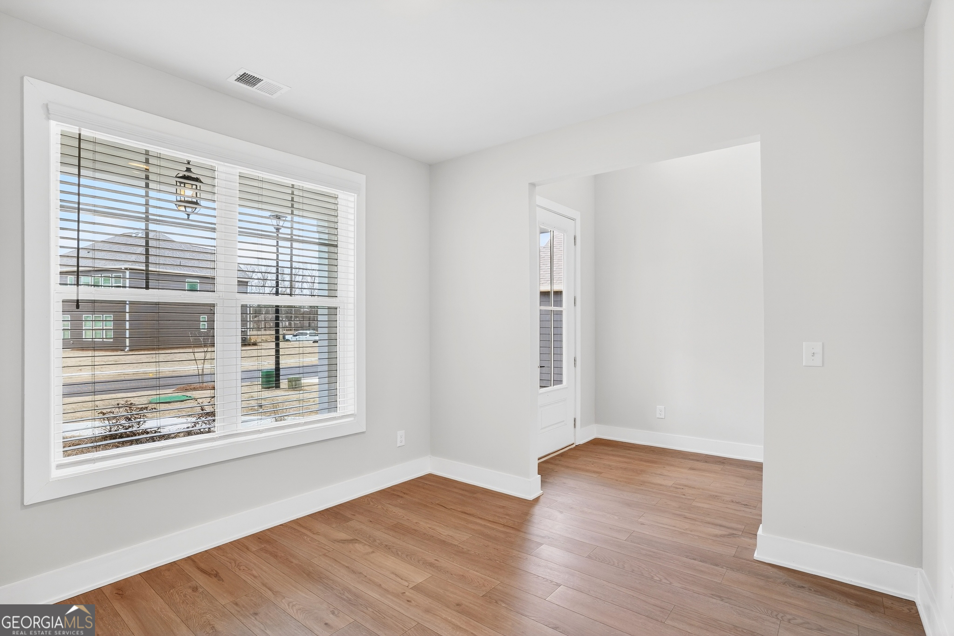 214 Villa Rica Springs Villa Rica, GA 30180 - Photo 6 of 33 Light-filled front flex room featuring oversized windows that beautifully invite natural sunlight.