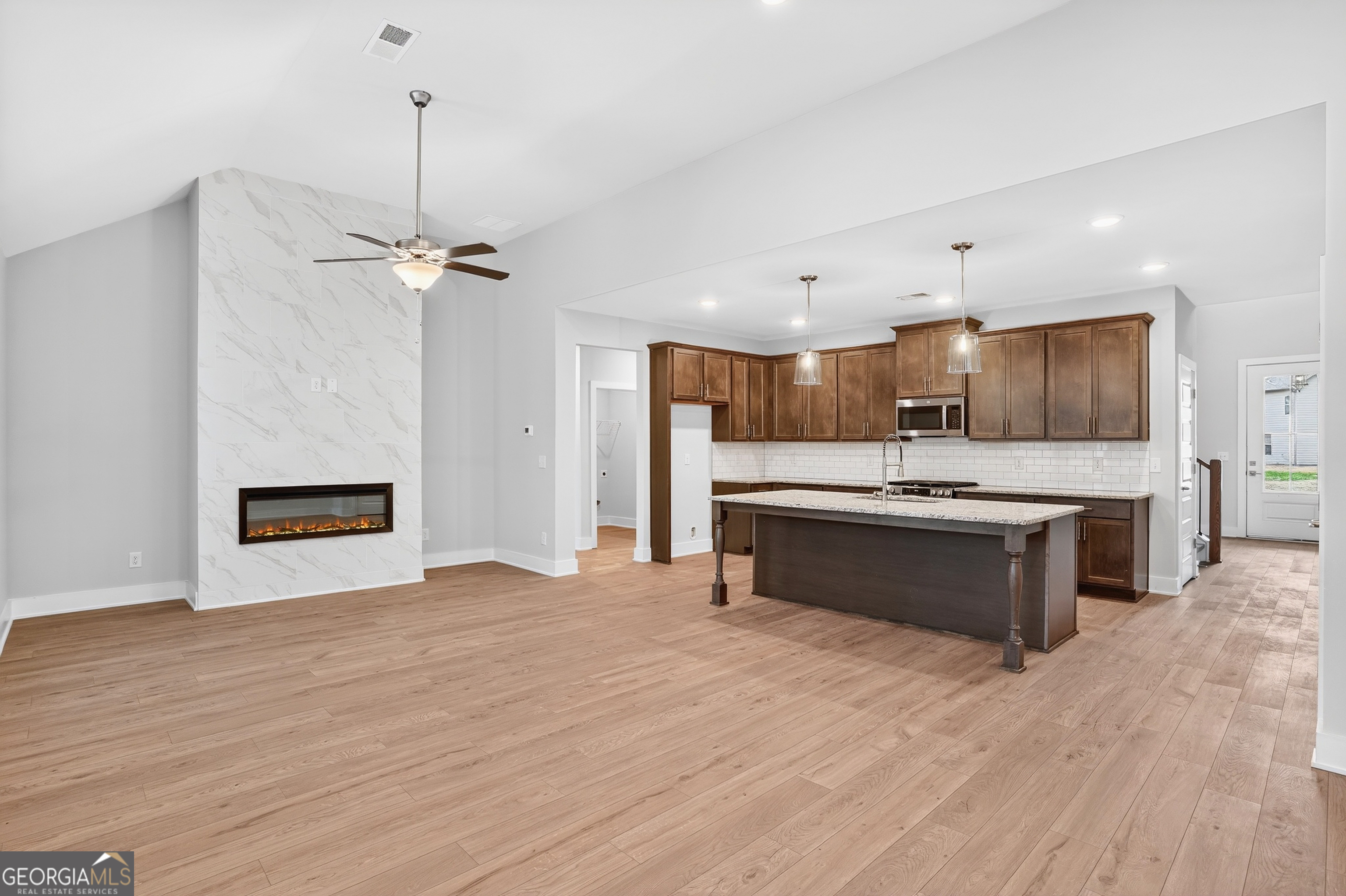 214 Villa Rica Springs Villa Rica, GA 30180 - Photo 9 of 33 Chef's kitchen featuring 42-inch soft-close cabinetry, subway tile backsplash, and a large center island perfect for family gatherings.