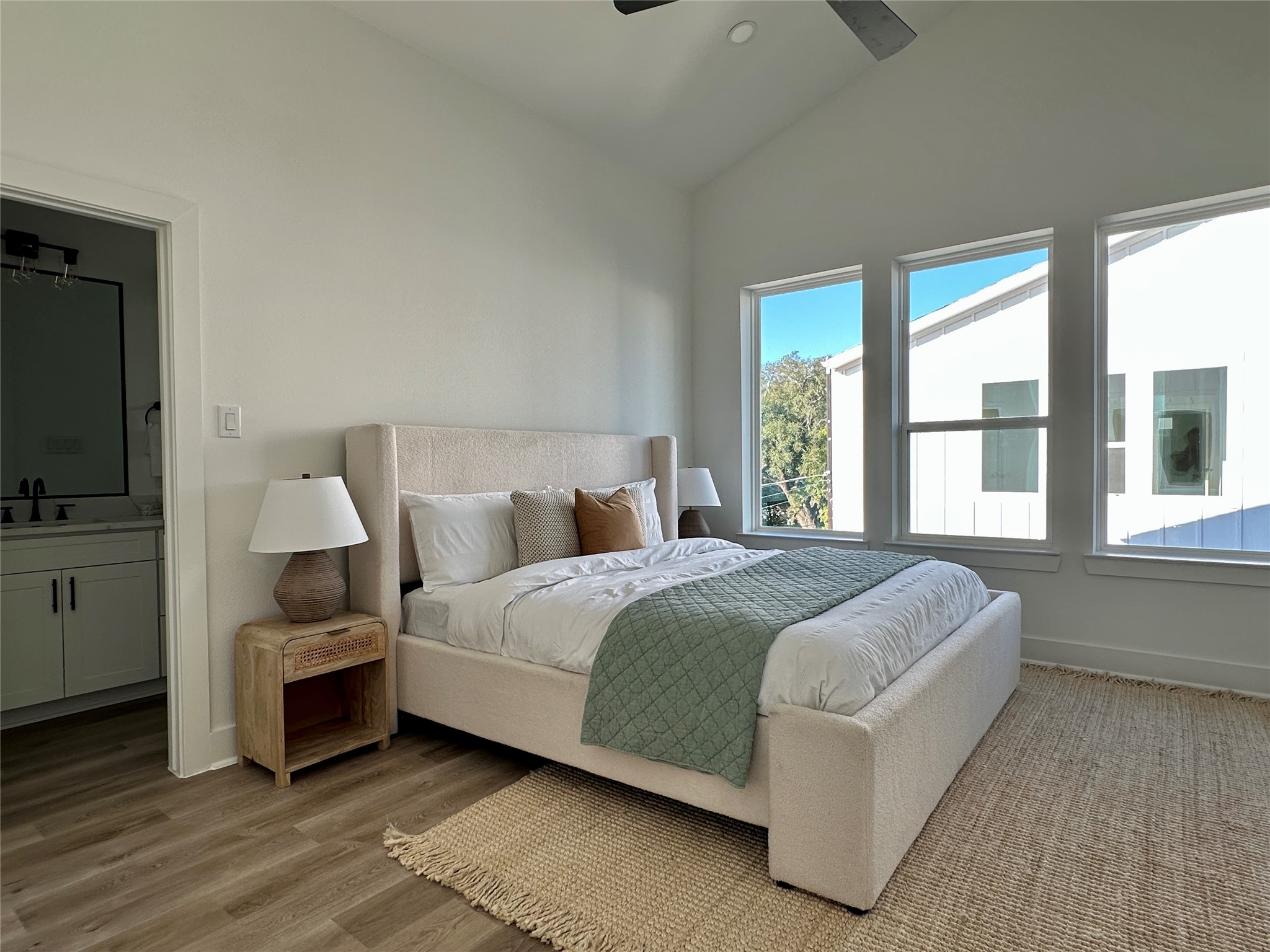 810 Elkhart Street, Unit B Houston, TX 77091 - Photo 33 of 50 a spacious bedroom with a bed and a flat screen tv