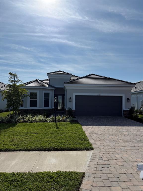 14708 Contenta Loop Lakewood Ranch, FL 34211 - Photo 1 of 1 a front view of a house with a yard
