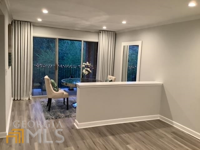 3097 Colonial Way, Unit M Chamblee, GA 30341 - Photo 5 of 11 a view of a living room and wooden floor
