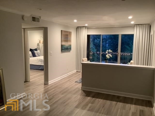 3097 Colonial Way, Unit M Chamblee, GA 30341 - Photo 7 of 11 a view of livingroom with furniture and window