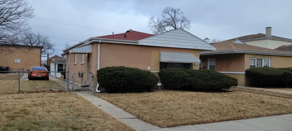 a car parked in front of a house
