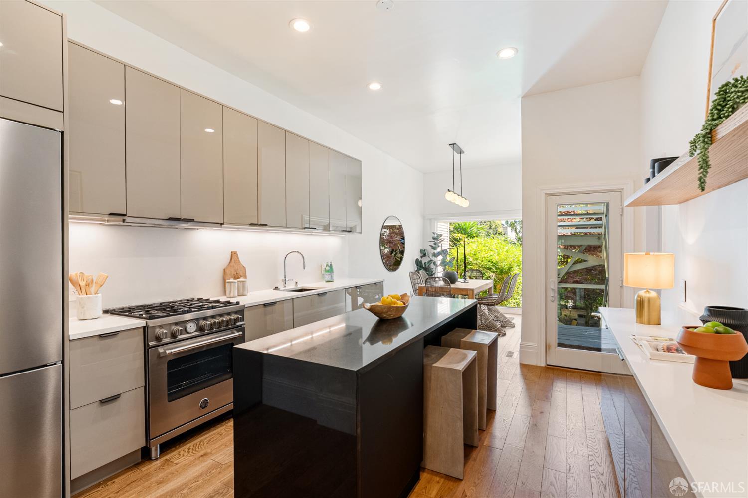 a kitchen with a sink stove and wooden cabinets