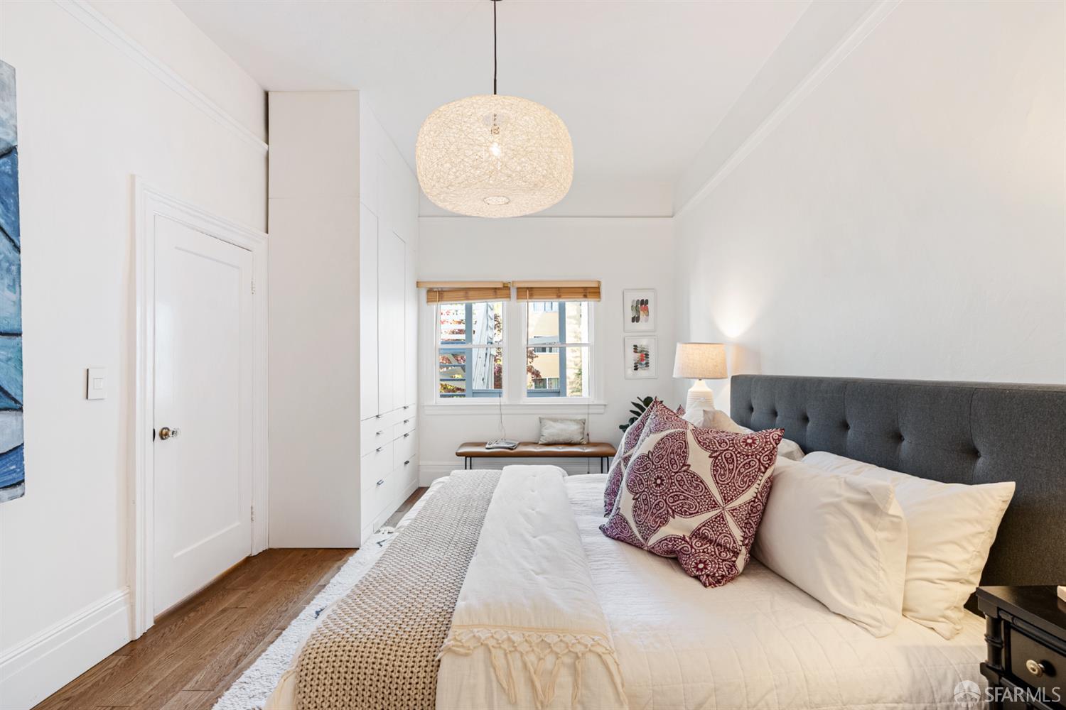 223 Sanchez Street San Francisco, CA 94114 - Photo 11 of 27 a spacious bedroom with a bed and a window