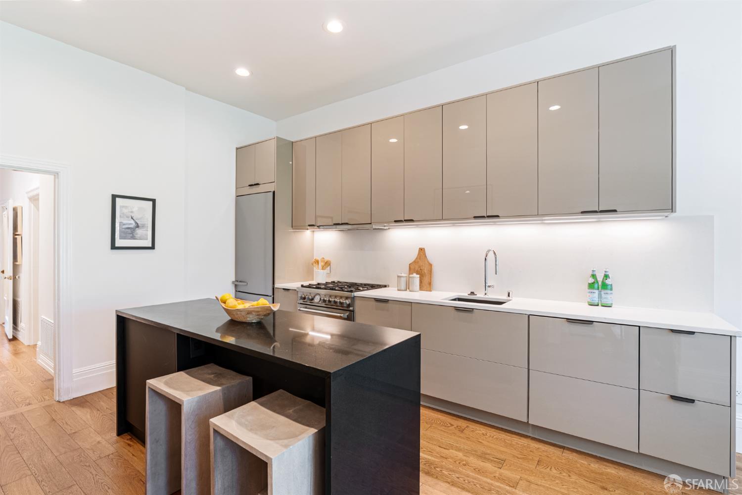223 Sanchez Street San Francisco, CA 94114 - Photo 2 of 27 a kitchen with a sink cabinets and wooden floor