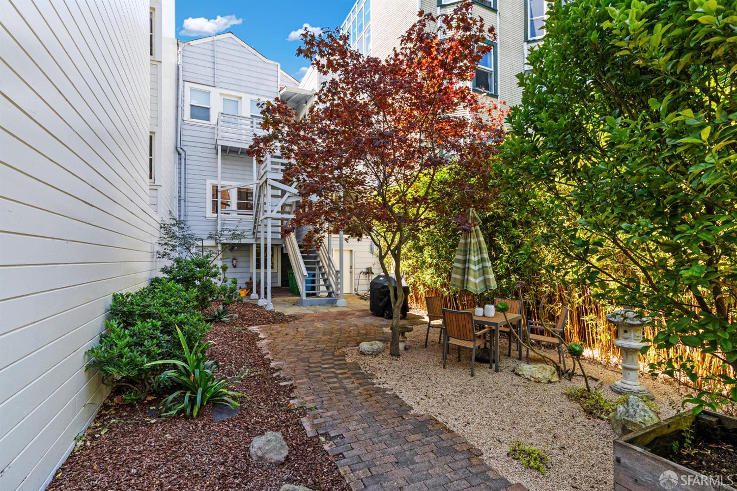 223 Sanchez Street San Francisco, CA 94114 - Photo 22 of 27 a view of a patio with table and chairs and potted plants