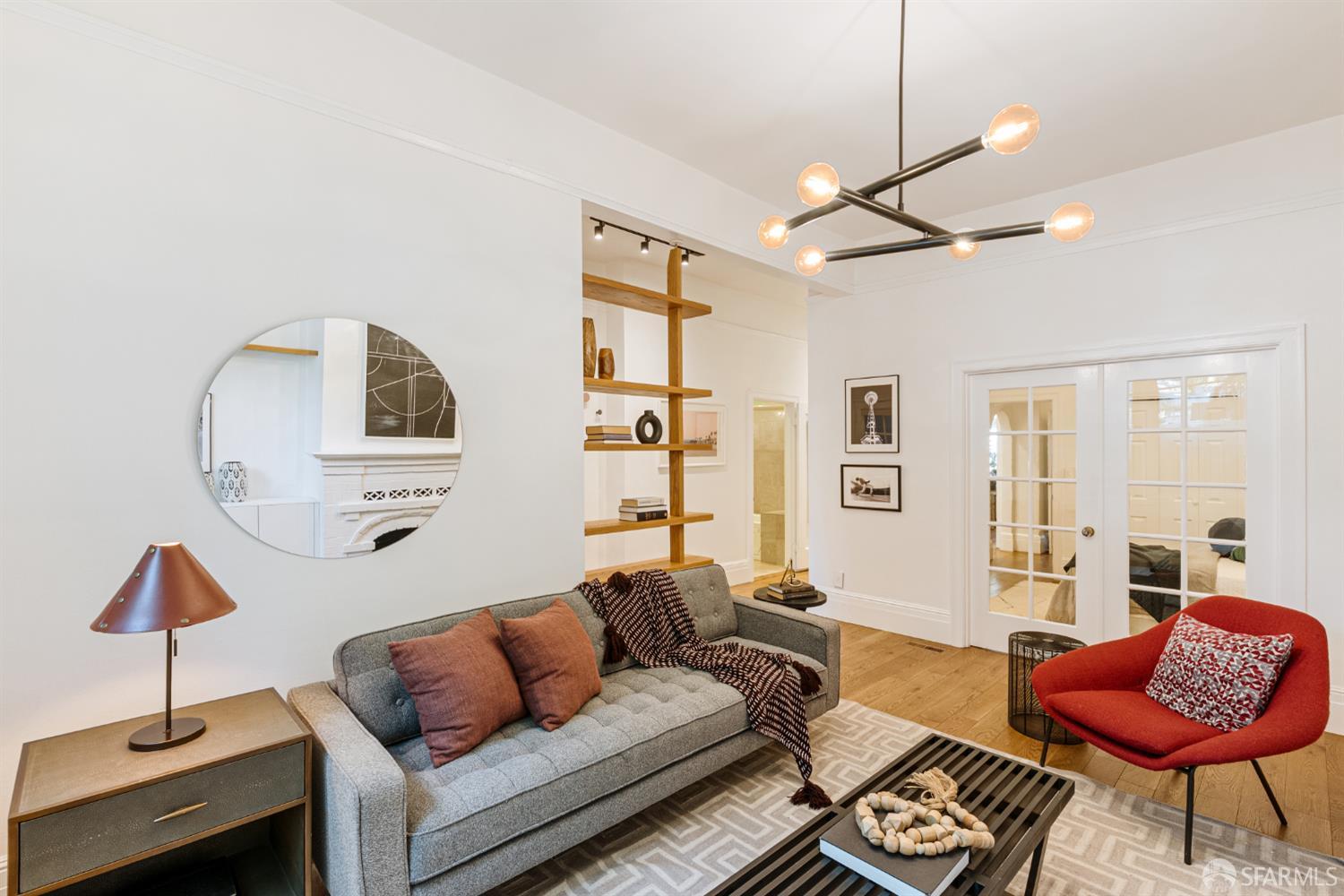 223 Sanchez Street San Francisco, CA 94114 - Photo 7 of 27 a living room with furniture a rug and a chandelier
