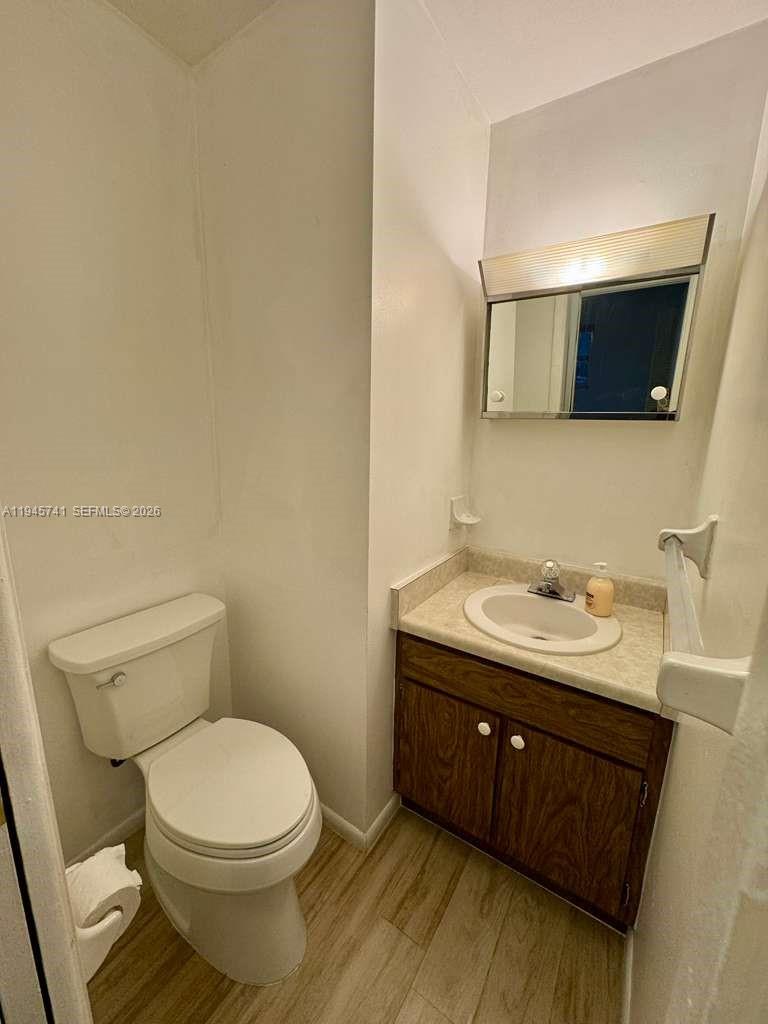 5100 Rilma Avenue Sarasota, FL 34234 - Photo 11 of 18 a bathroom with a toilet a sink and mirror