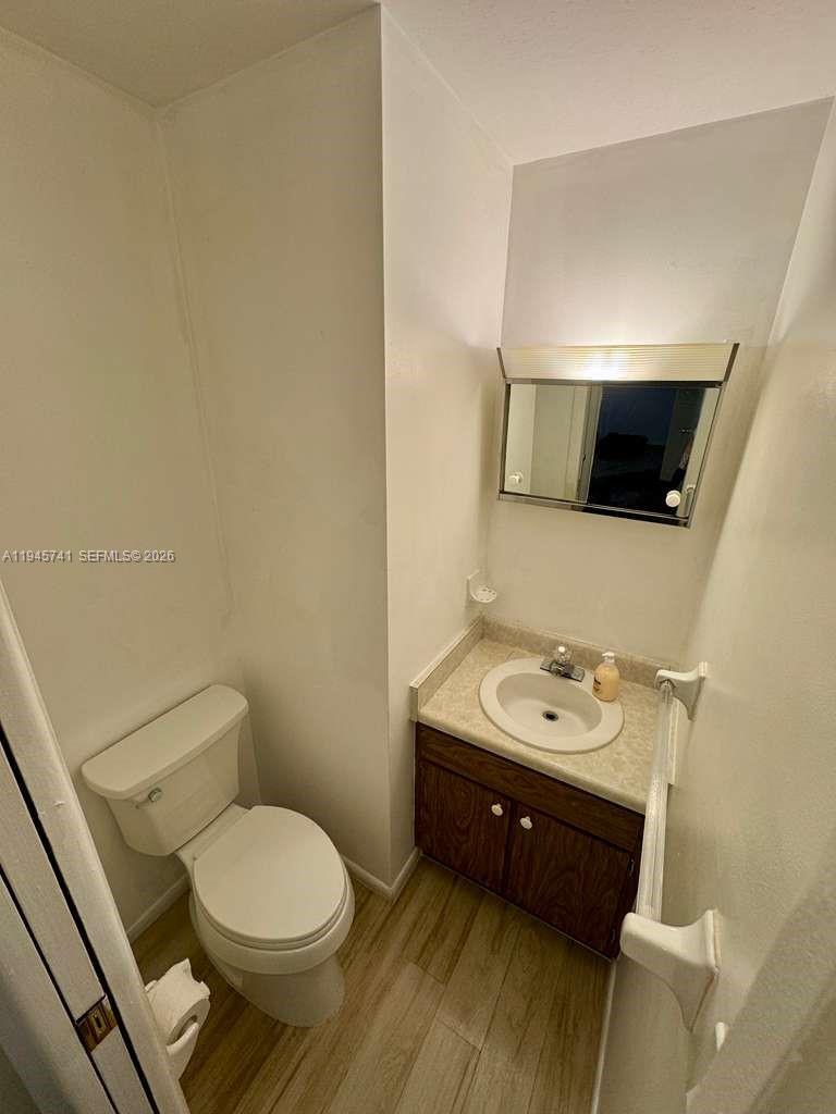 5100 Rilma Avenue Sarasota, FL 34234 - Photo 12 of 18 a bathroom with a toilet sink and mirror