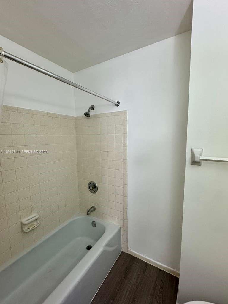 5100 Rilma Avenue Sarasota, FL 34234 - Photo 16 of 18 a bathroom with a bathtub and shower